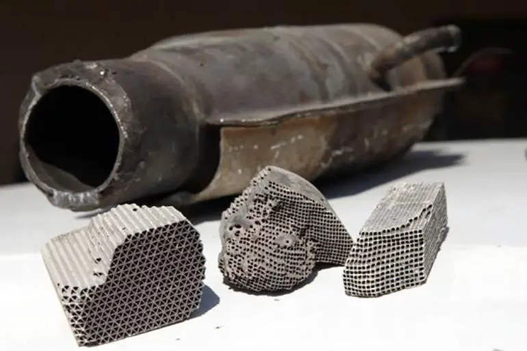 What are the causes of a clogged catalytic converter