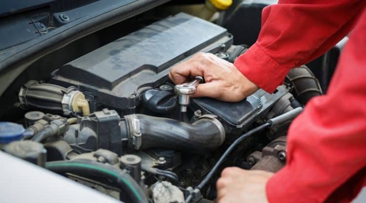 What are the costs associated with fixing a car that smells like rotten eggs