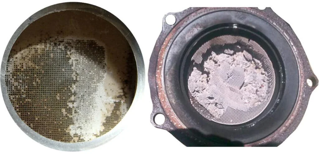 What are the symptoms of a clogged catalytic converter