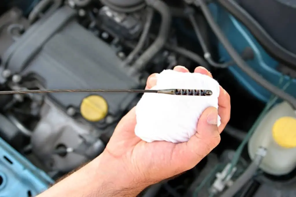 Way to measure oil with a dipstick.