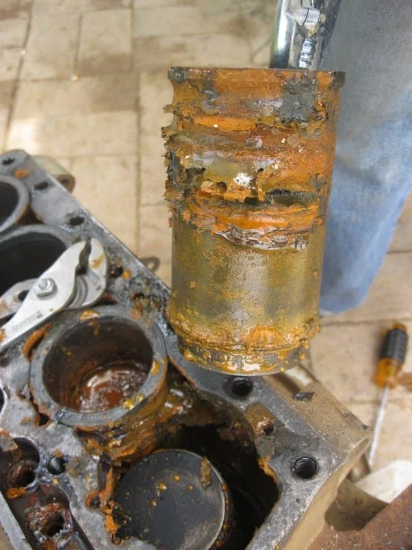 What damaged parts can lead to milky oil in engine